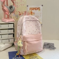 Dettaglio dello zaino scolastico rosa con motivi a stelle e ciondolo a luna di peluche - Con Ciondolo / Rosa