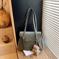Vintage grey-green leather tote bag with gold hardware and plush puppy charm - Green with Pendant