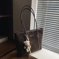 Dark brown suede tote bag with shoulder straps and a white plush bear keychain - Brown