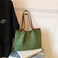 Green woven tote bag with brown straps and textured diamond pattern in retro setting - No Pendant / Green