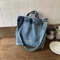 Borsa a secchiello in denim blu lavato vintage con doppi manici e scritte bianche - Azzurro