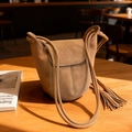 Brown frosted leather bucket bag with rope strap and contrast stitching details - Brown