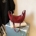 Elegant burgundy suede hobo bag with sleek leather strap on a silver suitcase - Wine Red Without Pendant