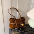 Dark brown suede tote bag with metal buckles and a yellow pom-pom charm on a book - Frosted Brown (With Charm)