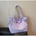 Close-up of lilac nylon tote bag featuring natural crinkled texture and woven rope details - Purple