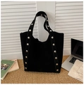 Detail of black suede tote bag with silver metal rivets on straps for office commute - Black