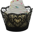 Detail of laser-cut black heart vine pattern cupcake wrappers for elegant party decoration - Black
