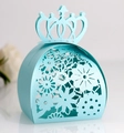 Close-up of laser-cut crown paper gift box in light blue with floral hollow pattern - Tiffany Blue