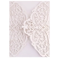 Elegant ivory laser-cut invitation card with intricate European scroll patterns - White