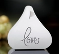 Detailed close-up of white laser-cut wedding candy box with elegant Love lettering - White