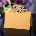 Elegant gold pearlescent table place card with intricate laser-cut hollow heart design - Gold