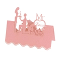 Macro detail of pink laser-cut wedding name cards with Mr and Mrs silhouettes - Pink