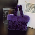 Plush tote bag in vibrant purple leopard print with faux fur trim for winter - Purple