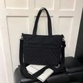 Black quilted tote bag with adjustable strap and diamond lattice pattern for daily commute - Black