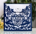 Detail of laser-cut navy blue wedding invitation with intricate rose hollow patterns - Deep Blue