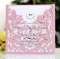 Pink laser-cut wedding invitation featuring rose patterns and a white internal card - Pink