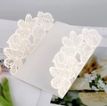 Detail of white laser-cut floral wedding invitation sleeve with elegant hollowed pattern - HK-34 (Hollow Botanical)