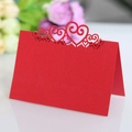 Red laser-cut wedding place card with intricate hollow heart pattern for table settings - Pearlescent Red