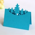 Blue laser-cut 3D folding Christmas card with a detailed forest and pine tree silhouette - Sky Blue
