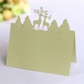 Elegant laser-cut light green place card featuring reindeer and forest design for Christmas - Emerald Green