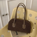 Deep brown faux fur shoulder bag with leather handles in a cozy winter style - Brown