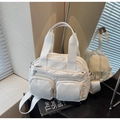 Minimalist white nylon crossbody bag with multi-pocket design and adjustable strap - Off-white