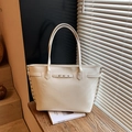 Chic beige tote bag with silver rivet details and slim shoulder straps for daily use - White