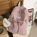 Mochila escolar rosa y beige con lazo decorativo y colgante de corazón a juego - Rosa