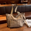 Large khaki canvas tote bag with front zipper pocket and wide strap for commuting - Khaki