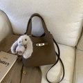 Dark brown leather bucket bag with a metal lock and a cute plush rabbit charm - Brown with Pendant