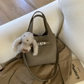 Fashionable khaki leather bucket bag with silver lock and plush bunny charm accessory - Elephant Gray with Charm