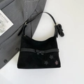 Fashionable black suede shoulder bag with bow detail and star patches on a white surface - Black without Pendant