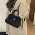 Suede black hobo tote bag worn by model in trench coat showing daily style - Black