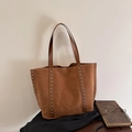 Brown suede tote bag with silver rivets and spacious shoulder strap design - Brown