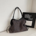Large leopard print tote bag with black straps and side drawstring fringe details - Gray