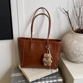 Brown vintage leather tote bag with vertical stitching and plush dog charm on top - Brown with Pendant