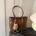 Retro brown leather tote bag with thin straps and a cute plush bear pendant accessory - Beige Khaki With Charm