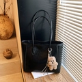 Large black shoulder tote bag in synthetic leather with a brown plush bear charm accessory - Black with Pendant