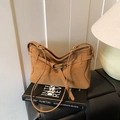 Brown matte tote bag with V-shaped opening and decorative metal buckle strap - Brown
