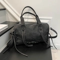 Distressed dark gray vintage moto bag featuring studs, lace-up details and long tassels - Black