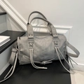 Grey wasteland style leather crossbody bag with silver hardware and tassels - Gray