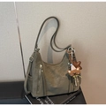 Detailed shot of olive green tote bag featuring zip pockets and a cute bear charm - Single Bag / Green