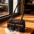 Dark brown vintage Boston bag in shiny leather with two front buckled pockets - Coffee