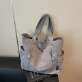 Gray versatile nylon tote bag with multiple pockets and top handles for casual commuting - Gray