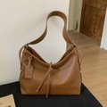 Caramel brown matte leather tote bag with wide strap and tassel tie decoration - Brown