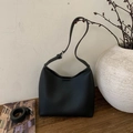 Minimalist black bucket shoulder bag in pebble grain leather with adjustable strap - Black
