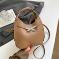 Brown litchi grain leather bucket bag with silver cross lock and shoulder strap - Biscuit No Charm