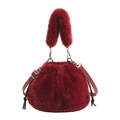 Deep red faux fur bucket bag with drawstring closure and leather shoulder strap detail - Red