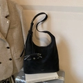 Minimalist black leather tote bag with side glasses pocket on silver luggage - Black