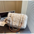 Close-up of fluffy white faux fur tote bag with metal chain strap and cute rabbit pendant - Cream White With Pendant